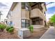 Multi-level condo building featuring tan stucco and well-maintained landscaping at 5060 Jeffreys St # 201, Las Vegas, NV 89119