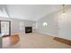 Cozy living room with fireplace, neutral carpet, hardwood floors and stylish lighting at 5060 Jeffreys St # 201, Las Vegas, NV 89119