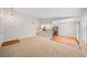Spacious living room featuring carpet, hardwood floors, and views to the kitchen at 5060 Jeffreys St # 201, Las Vegas, NV 89119