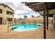 Sparkling community pool with plenty of deck space and seating for residents to enjoy at 5060 Jeffreys St # 201, Las Vegas, NV 89119