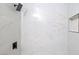 Close up of the shower featuring brown marble-style tile walls and built-in shower niche at 5060 Jeffreys St # 201, Las Vegas, NV 89119