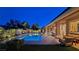 Backyard with manicured landscaping, a large pool, and a covered patio create the perfect outdoor retreat at 5416 Alabaster Ct, Las Vegas, NV 89149