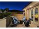 Relaxing upstairs balcony with firepit, comfortable seating and exterior entry door at 5416 Alabaster Ct, Las Vegas, NV 89149