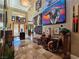 Grand foyer featuring high ceilings, travertine floors, artwork, and wood doors with glass inserts at 5416 Alabaster Ct, Las Vegas, NV 89149