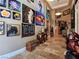 Inviting foyer with high ceilings, travertine floors, artwork, and access to multiple rooms at 5416 Alabaster Ct, Las Vegas, NV 89149