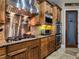Gourmet kitchen features stainless steel appliances, a gas cooktop and custom cabinetry at 5416 Alabaster Ct, Las Vegas, NV 89149