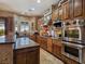 Gourmet kitchen features stainless steel appliances, a gas cooktop, and granite countertops at 5416 Alabaster Ct, Las Vegas, NV 89149