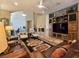 Bright living room featuring a fireplace, custom built-ins and comfortable leather seating at 5416 Alabaster Ct, Las Vegas, NV 89149