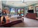 Brightly lit main bedroom with a view of the pool through the French doors at 5416 Alabaster Ct, Las Vegas, NV 89149