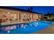 Tranquil backyard pool and patio at twilight; great for relaxation or entertaining guests at 5416 Alabaster Ct, Las Vegas, NV 89149