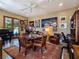 Versatile room with piano, table, chairs, and unique decor creates a multi-functional space at 5416 Alabaster Ct, Las Vegas, NV 89149