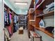 Spacious walk-in closet with custom shelving for clothing and shoes at 5416 Alabaster Ct, Las Vegas, NV 89149
