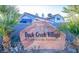 Entrance to Duck Creek Village, a welcoming condominium community nestled amongst palm trees at 5419 Centurion Ct # 102, Las Vegas, NV 89122