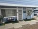 Charming exterior showcasing a well-maintained facade with outdoor seating and landscaping at 5419 Centurion Ct # 102, Las Vegas, NV 89122