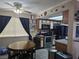 Eat-in kitchen with wood cabinets, stainless steel appliances, and a ceiling fan at 5419 Centurion Ct # 102, Las Vegas, NV 89122