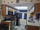 Eat-in kitchen boasting granite countertops, wood cabinets, and stainless-steel appliances at 5419 Centurion Ct # 102, Las Vegas, NV 89122