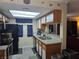 Eat-in kitchen boasting granite countertops, wood cabinets, and stainless-steel appliances at 5419 Centurion Ct # 102, Las Vegas, NV 89122