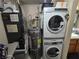Utility room features laundry machines, water heater, and HVAC unit for comfort and convenience at 5419 Centurion Ct # 102, Las Vegas, NV 89122