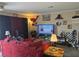 Living room featuring a decorative fireplace and plenty of natural light at 5419 Centurion Ct # 102, Las Vegas, NV 89122