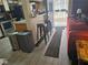 Cozy living room featuring tile floors, bar seating, and natural light at 5419 Centurion Ct # 102, Las Vegas, NV 89122