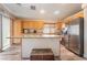 Modern kitchen island with granite countertop, stainless steel appliances, and ample cabinet space at 5532 Sentinel Bridge St, Las Vegas, NV 89130