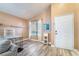 Well-lit living space with wood-look flooring, neutral walls, and open layout at 5532 Sentinel Bridge St, Las Vegas, NV 89130