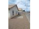 Side yard featuring gravel landscaping, a concrete patio, and block wall at 600 Sarajane Ln, Las Vegas, NV 89107