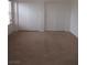 Bedroom features neutral carpet and a closet with sliding doors at 600 Sarajane Ln, Las Vegas, NV 89107