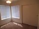 This bedroom is carpeted and has a closet and bright windows at 600 Sarajane Ln, Las Vegas, NV 89107