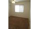 A bright bedroom features a closet, neutral carpet, and natural light at 600 Sarajane Ln, Las Vegas, NV 89107