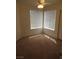 This cozy bedroom features neutral carpet, bright windows, and a ceiling fan at 600 Sarajane Ln, Las Vegas, NV 89107