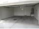 Spacious two car garage with white walls, concrete flooring, and water heater at 600 Sarajane Ln, Las Vegas, NV 89107