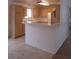 Bright kitchen featuring tile flooring, an island, and ample counter space at 600 Sarajane Ln, Las Vegas, NV 89107