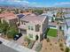 Two-story home with desert landscaping, a two-car garage, and a stucco facade in a vibrant community at 6142 W Levi Ave, Las Vegas, NV 89141