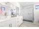 Contemporary bathroom featuring a double vanity, marble shower, and modern fixtures at 6142 W Levi Ave, Las Vegas, NV 89141