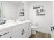 Modern bathroom featuring double sinks, ample vanity storage, and sleek black hardware at 6142 W Levi Ave, Las Vegas, NV 89141