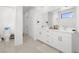 Clean bathroom includes a double vanity, modern toilet, and neutral wall color at 6142 W Levi Ave, Las Vegas, NV 89141