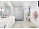 Modern bathroom features double vanity, sleek fixtures, and a glass enclosed shower at 6142 W Levi Ave, Las Vegas, NV 89141