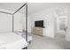 Spacious bedroom with neutral carpet, white walls, and en-suite bathroom access at 6142 W Levi Ave, Las Vegas, NV 89141