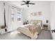 Stylish bedroom featuring a modern bed frame, neutral decor, and large bright windows at 6142 W Levi Ave, Las Vegas, NV 89141
