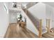 Inviting entryway with a staircase, light wood floors, and lots of natural light from upper landing at 6142 W Levi Ave, Las Vegas, NV 89141