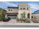 Charming two-story home featuring a stucco facade, well-maintained landscaping, and a two-car garage at 6142 W Levi Ave, Las Vegas, NV 89141