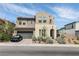 Charming two-story home featuring a stucco facade, well-maintained landscaping, and a two-car garage at 6142 W Levi Ave, Las Vegas, NV 89141