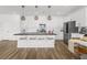 Well-equipped kitchen with stainless steel appliances, island seating, and ample counter space at 6142 W Levi Ave, Las Vegas, NV 89141