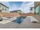 Inviting backyard pool with modern design, spa, tanning deck, and lounge chairs at 6142 W Levi Ave, Las Vegas, NV 89141