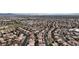 Bird's eye view captures a community with symmetrical streets, well-kept houses, and verdant green spaces at 6407 Wild Strawberry Ln, Las Vegas, NV 89142