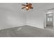 Bedroom with ceiling fan boasts a carpeted floor and an ensuite bathroom at 6407 Wild Strawberry Ln, Las Vegas, NV 89142