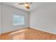 Bright bedroom with hardwood floors and a large window at 6407 Wild Strawberry Ln, Las Vegas, NV 89142