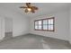 Bedroom with ceiling fan has carpeted floors and window with wooden blinds at 6407 Wild Strawberry Ln, Las Vegas, NV 89142