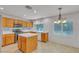 Well-lit kitchen with an island, modern appliances, and tiled flooring at 6407 Wild Strawberry Ln, Las Vegas, NV 89142